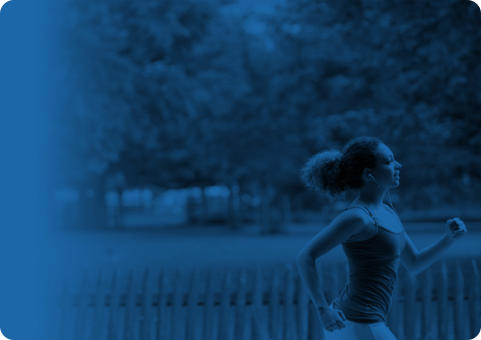 Blue banner with an image of a young woman jogging through a neighborhood on a sunny day. There is a picket fence and open field behind her.