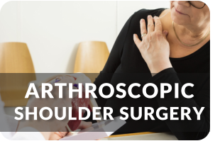 A senior woman holds her right shoulder with her left hand as her doctor explains her condition. Title reads: Arthroscopic Shoulder Surgery